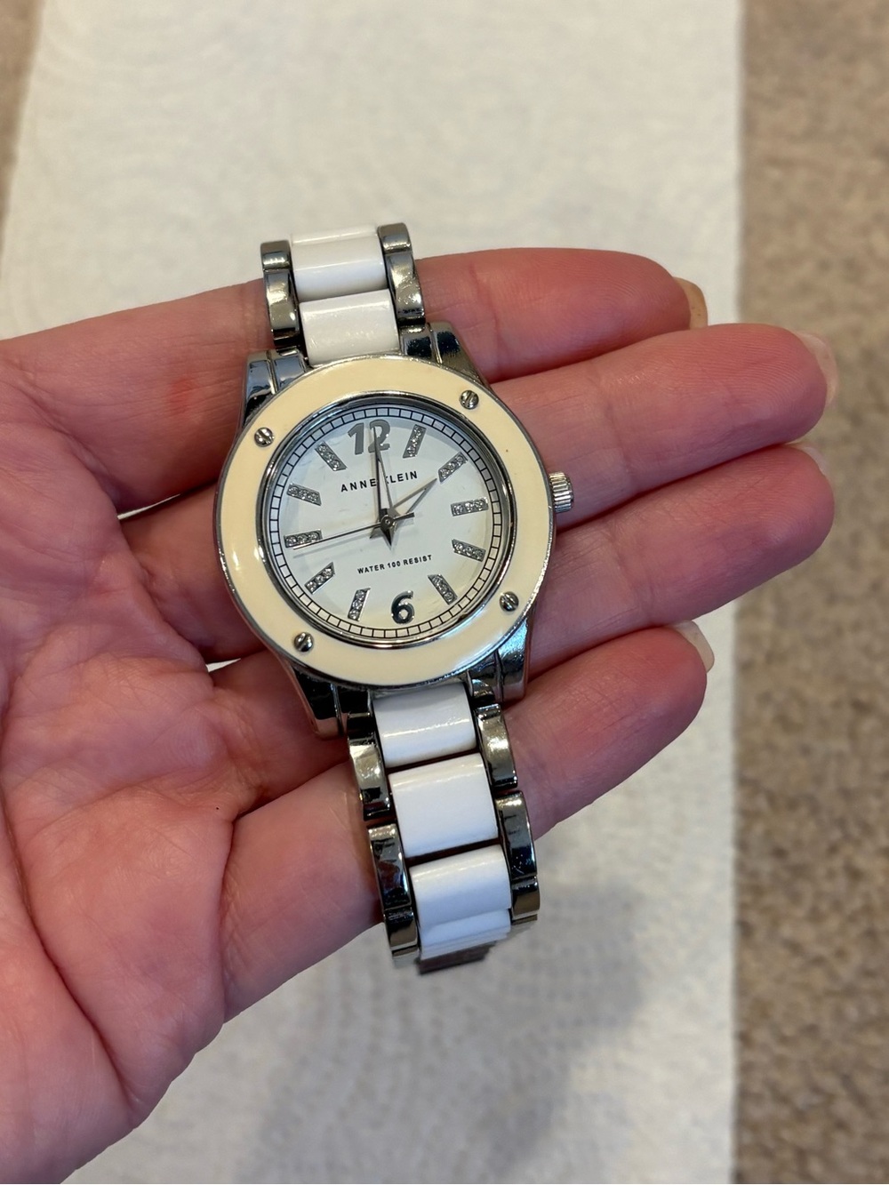 Women’s Anne Klein silver watch w/crystal hour markers & white ceramic link band